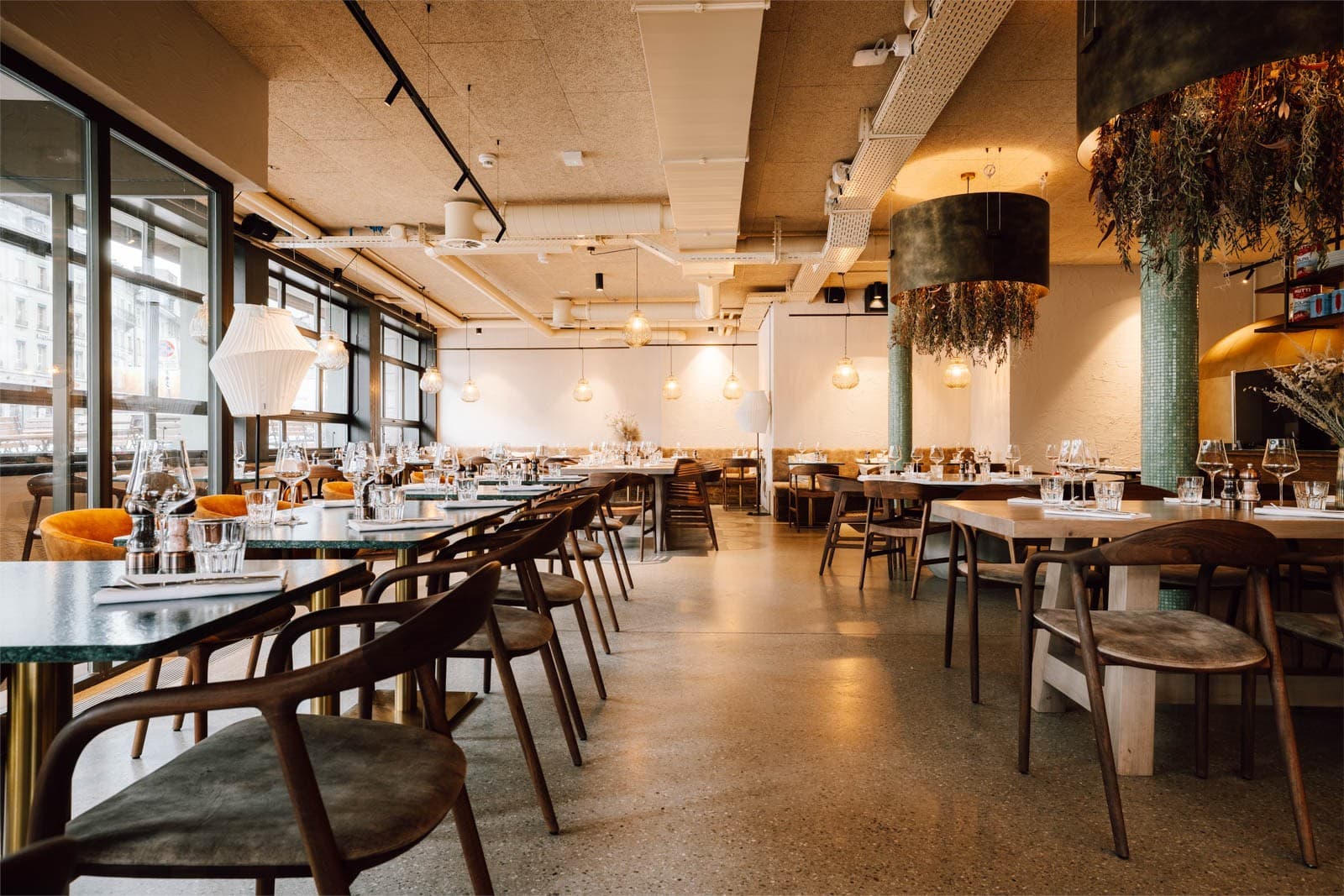 Olive restaurant — arched bar with curated spirits